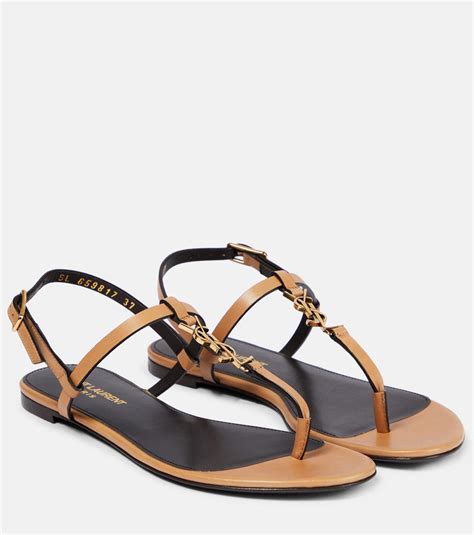 Cassandra leather thong sandals in brown .